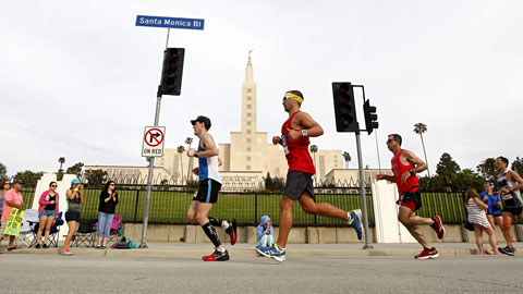 Runners pass the Los Angeles Temple