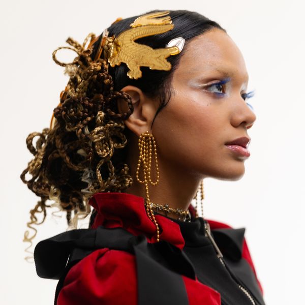 She makes wigs like they’re armor. There’s a sweetness with a bite