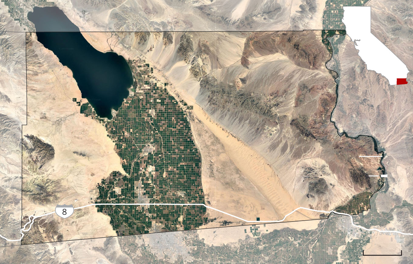 Satellite image of irrigated land surrounded by desert in Imperial County in relation to the Salton Sea, Interstate 8 and the borders with Mexico and Arizona.